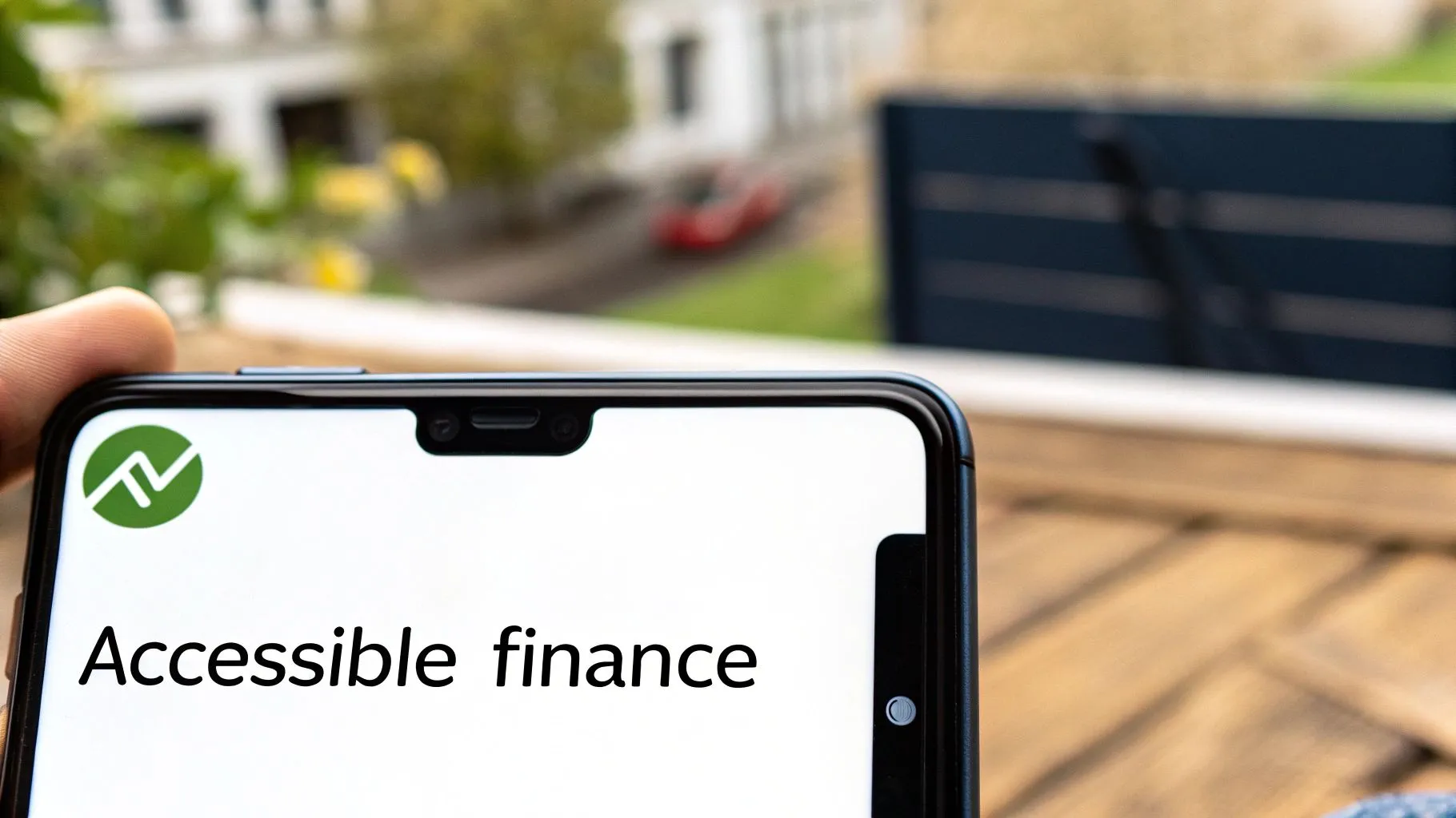 A person holding a smartphone displaying an app with a green logo and 'Accessible finance' text.