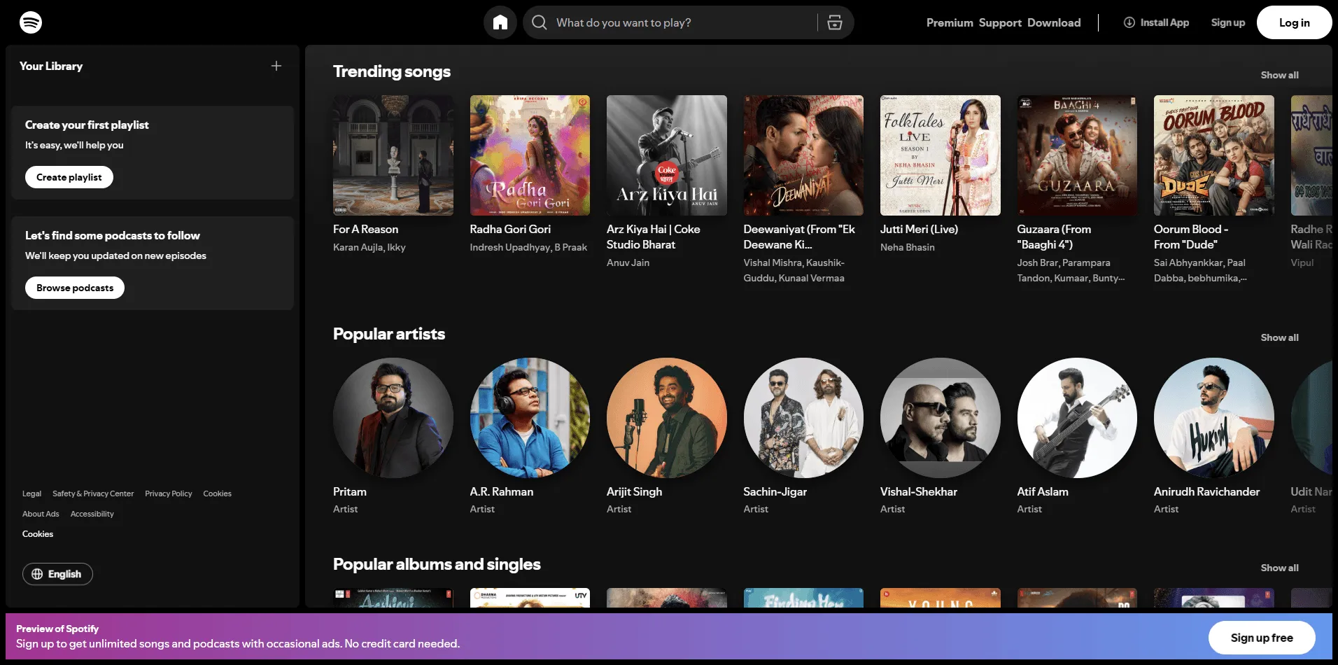 Spotify website header with minimalist navigation, bold Sign Up and Log In buttons, and personalized recommendations.